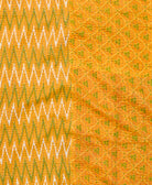kantha quilt throw with a tag featuring the hand-stitched signature of the maker