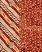 kantha quilt throw with a tag featuring the hand-stitched signature of the maker