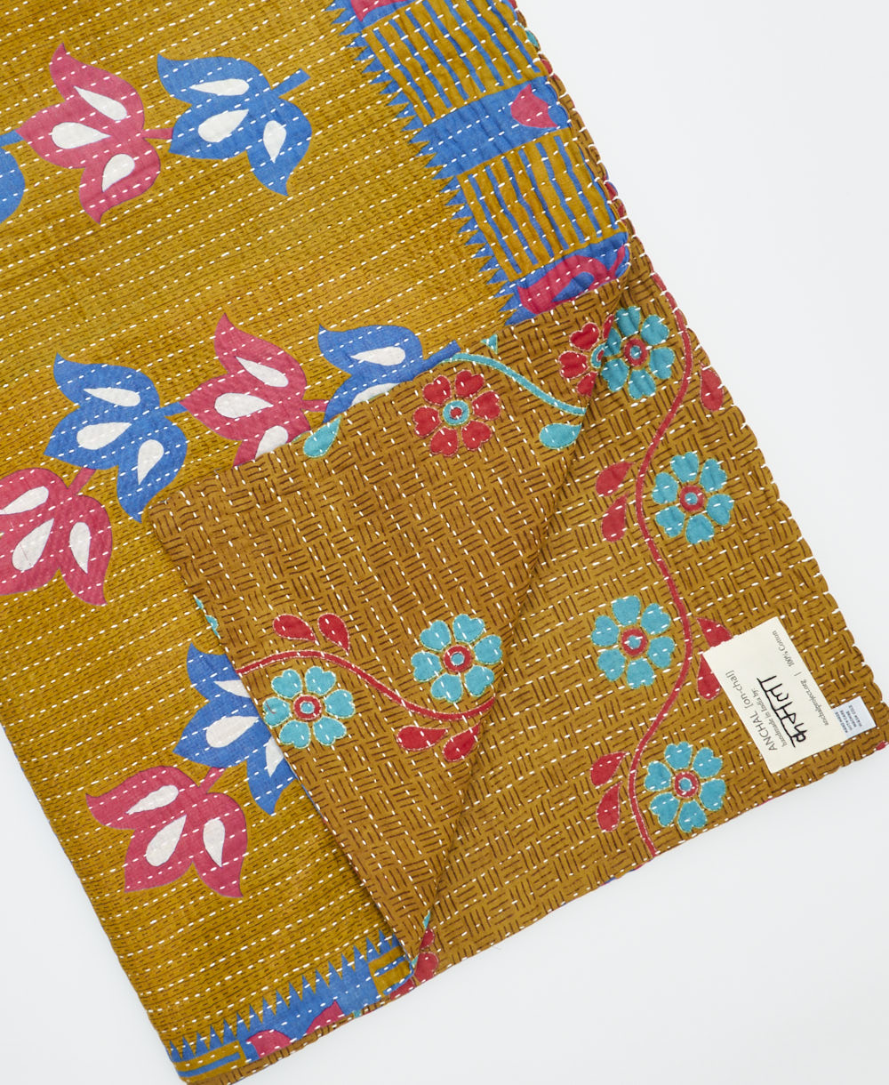 Kantha quilt throw featuring traditional kantha hand stitching