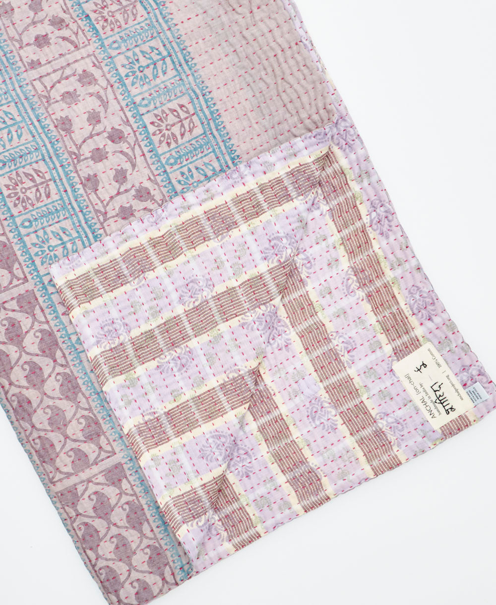 Kantha quilt throw featuring traditional kantha hand stitching