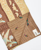 Kantha quilt throw featuring traditional kantha hand stitching