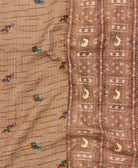 kantha quilt throw with a tag featuring the hand-stitched signature of the maker