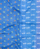 kantha quilt throw with a tag featuring the hand-stitched signature of the maker