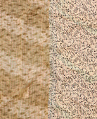 kantha quilt throw with a tag featuring the hand-stitched signature of the maker
