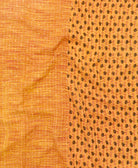 kantha quilt throw with a tag featuring the hand-stitched signature of the maker