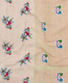 kantha quilt throw with a tag featuring the hand-stitched signature of the maker