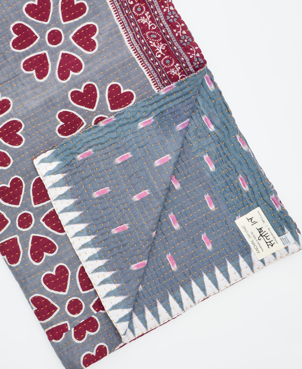 Kantha quilt throw featuring traditional kantha hand stitching
