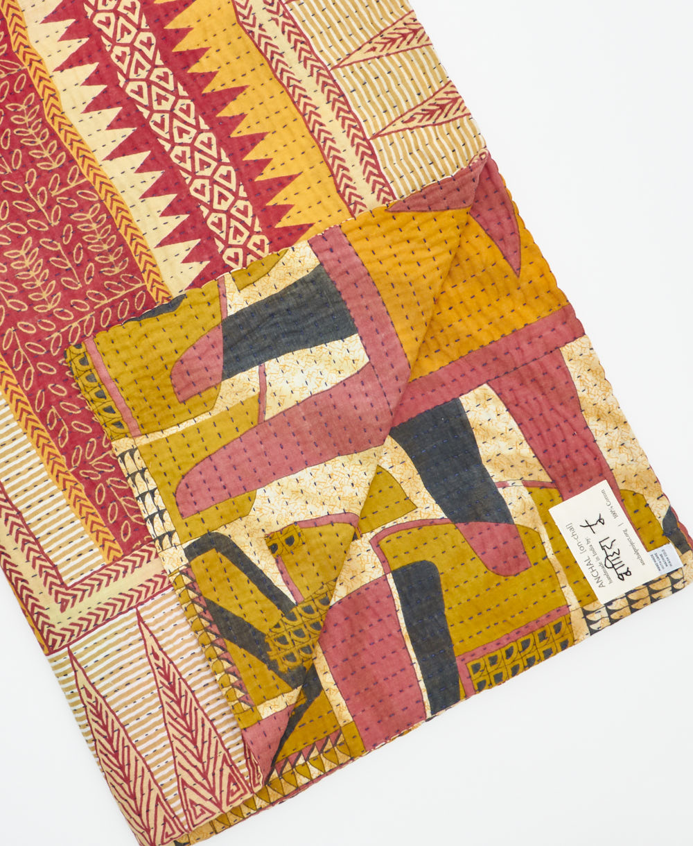 Kantha quilt throw featuring traditional kantha hand stitching