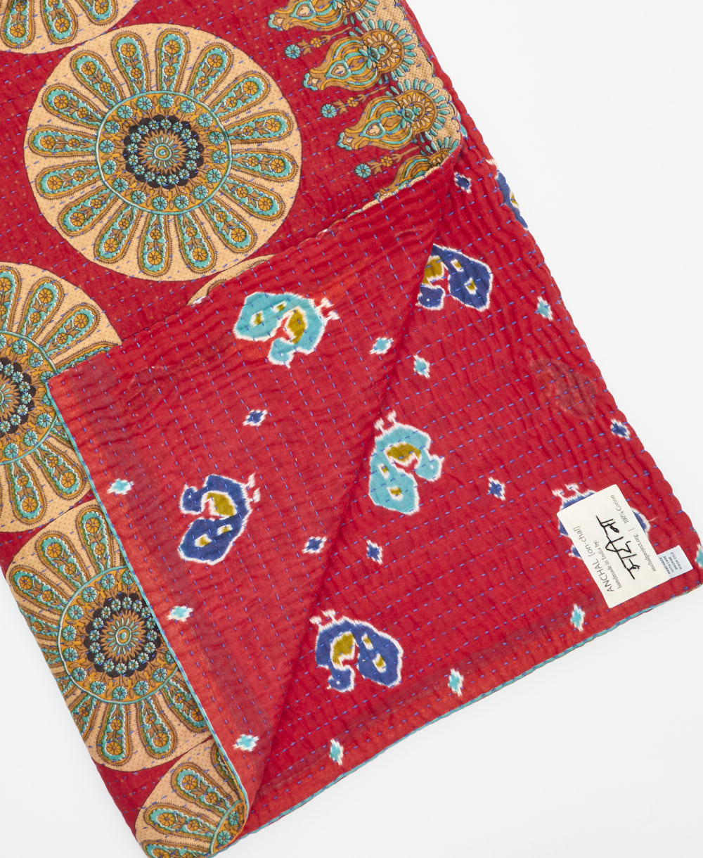 Kantha quilt throw featuring traditional kantha hand stitching