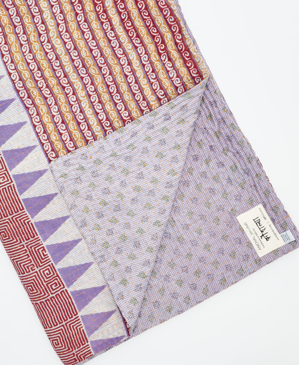 Kantha quilt throw featuring traditional kantha hand stitching