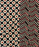 kantha quilt throw with a tag featuring the hand-stitched signature of the maker