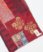 Kantha quilt throw featuring traditional kantha hand stitching