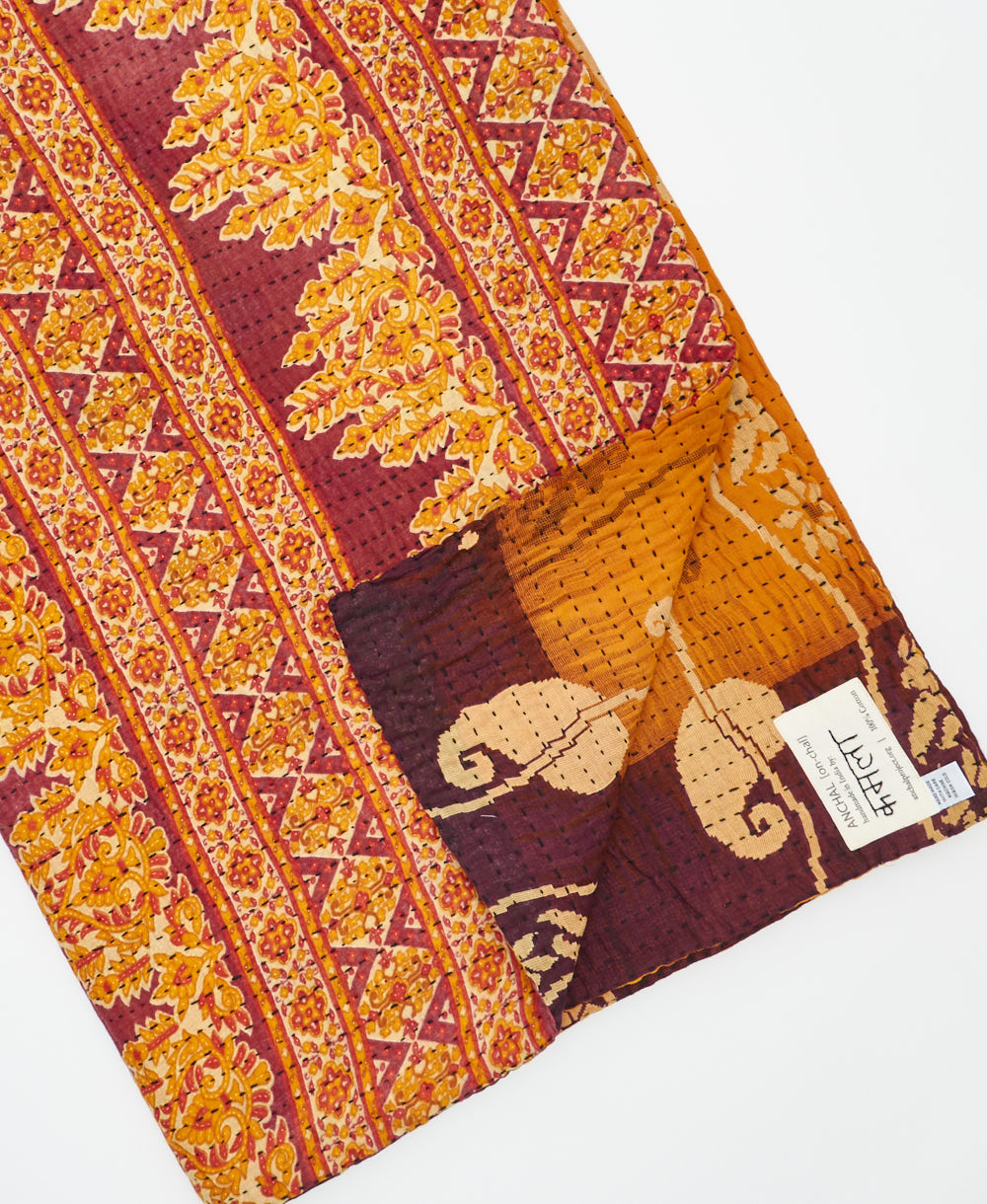 Kantha quilt throw featuring traditional kantha hand stitching