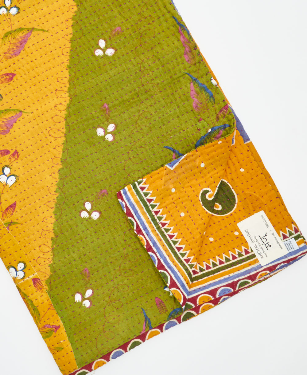 Kantha quilt throw featuring traditional kantha hand stitching