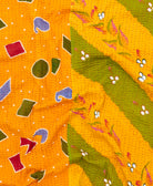 kantha quilt throw with a tag featuring the hand-stitched signature of the maker