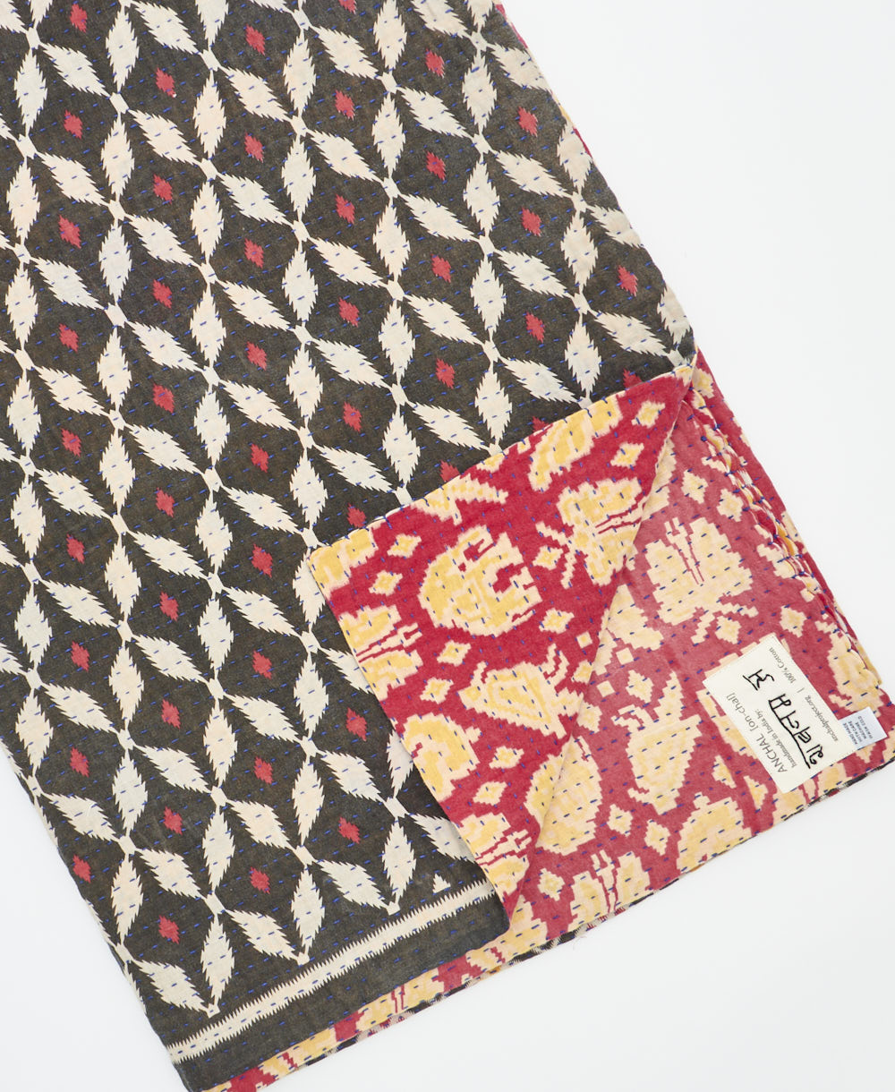 Kantha quilt throw featuring traditional kantha hand stitching