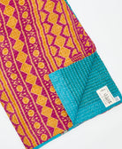 Kantha quilt throw featuring traditional kantha hand stitching