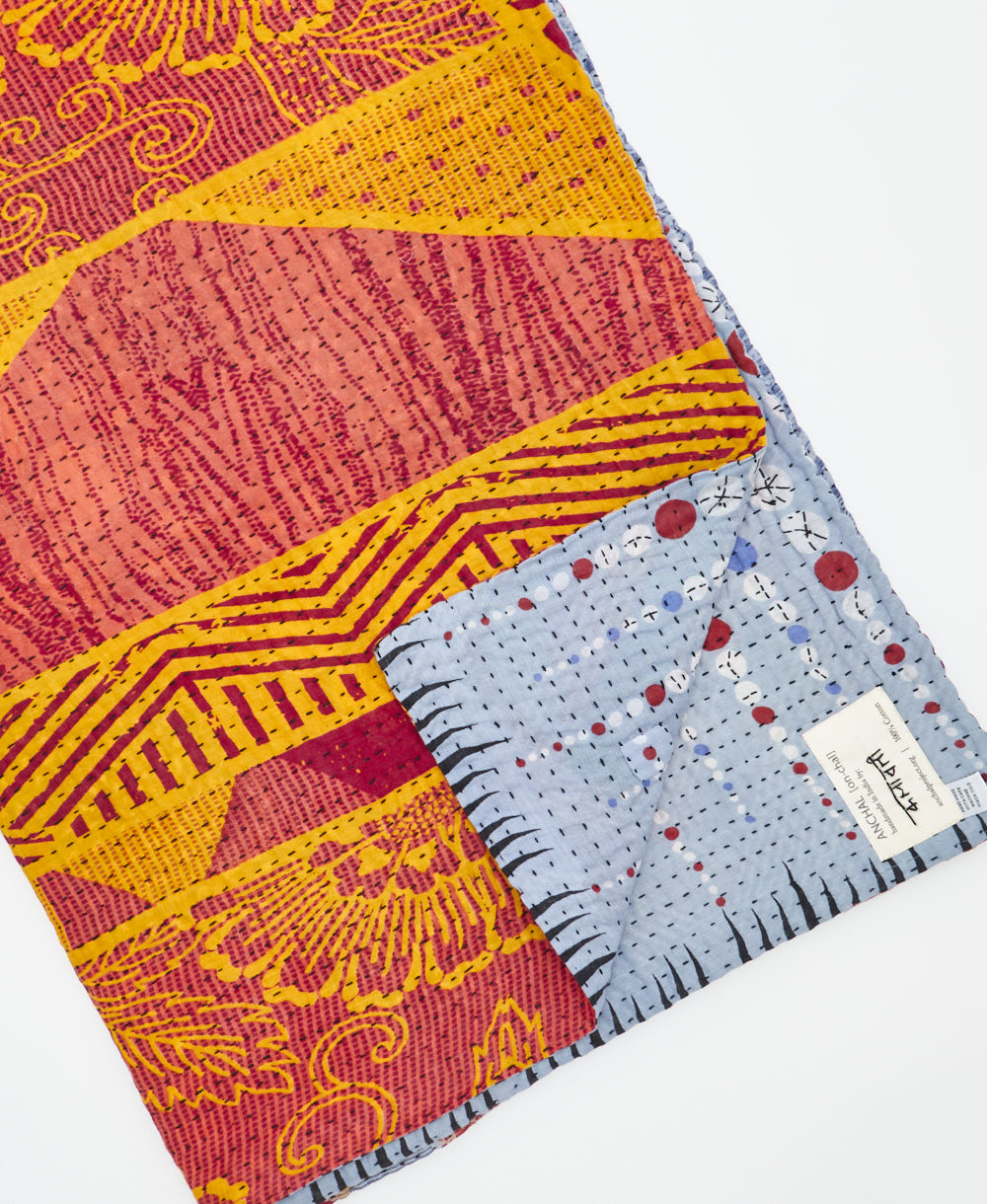 Kantha quilt throw featuring traditional kantha hand stitching