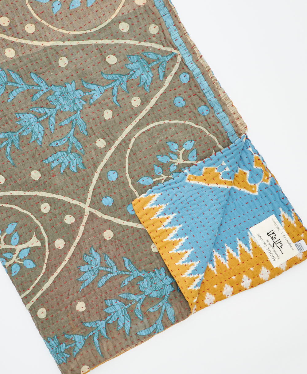 Kantha quilt throw featuring traditional kantha hand stitching