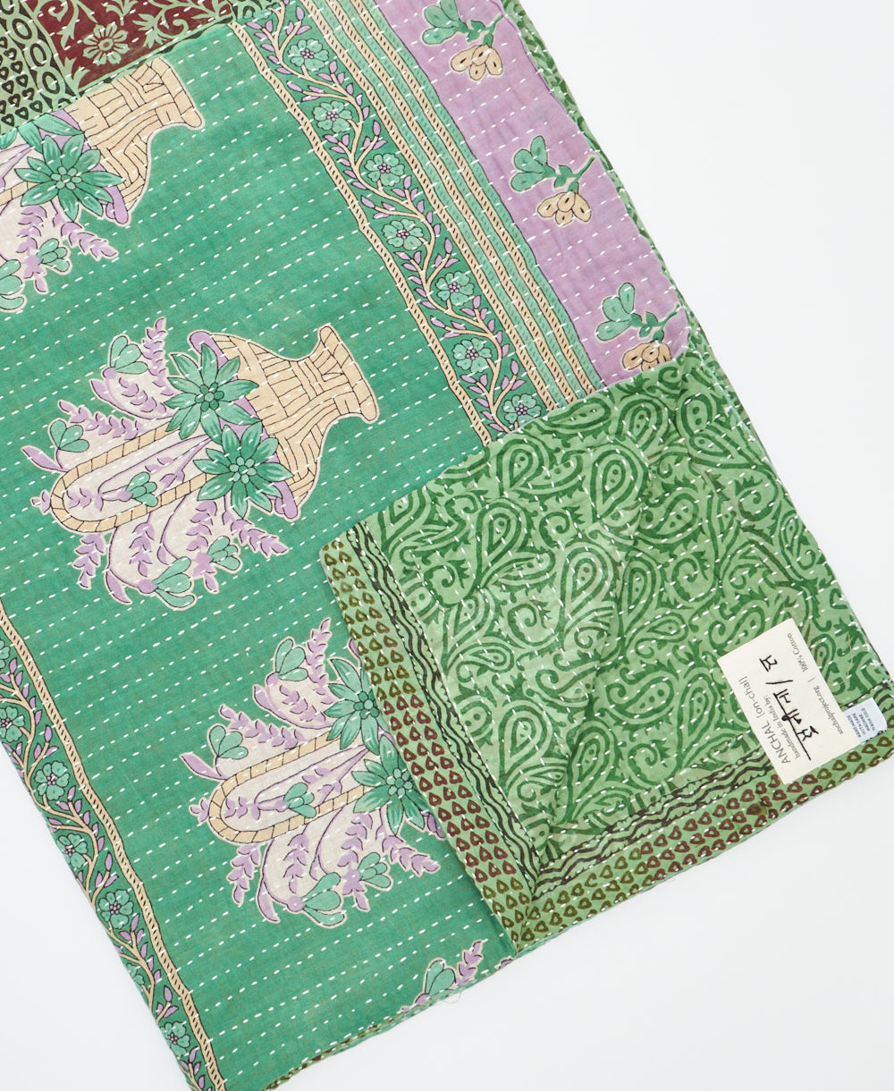 Kantha quilt throw featuring traditional kantha hand stitching