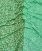 kantha quilt throw with a tag featuring the hand-stitched signature of the maker