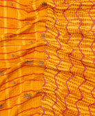 kantha quilt throw with a tag featuring the hand-stitched signature of the maker