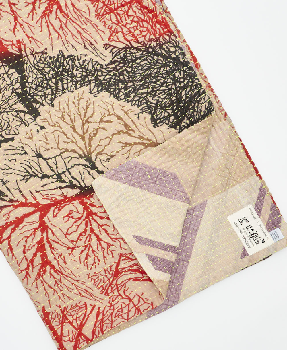 Kantha quilt throw featuring traditional kantha hand stitching