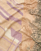 kantha quilt throw with a tag featuring the hand-stitched signature of the maker