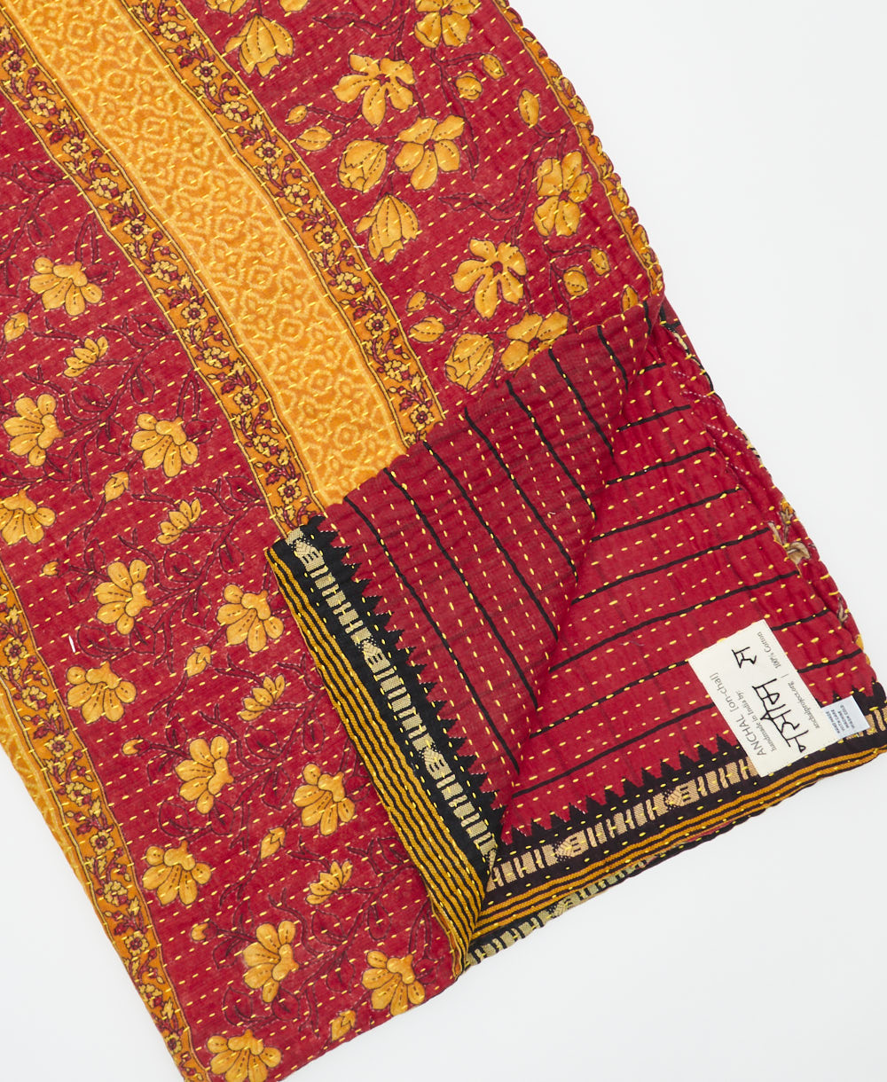 Kantha quilt throw featuring traditional kantha hand stitching