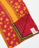 Kantha quilt throw featuring traditional kantha hand stitching