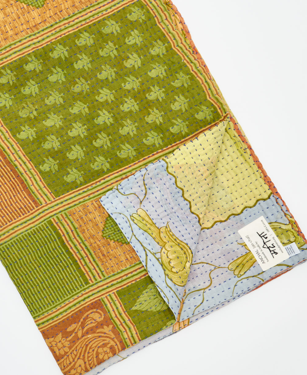 Kantha quilt throw featuring traditional kantha hand stitching
