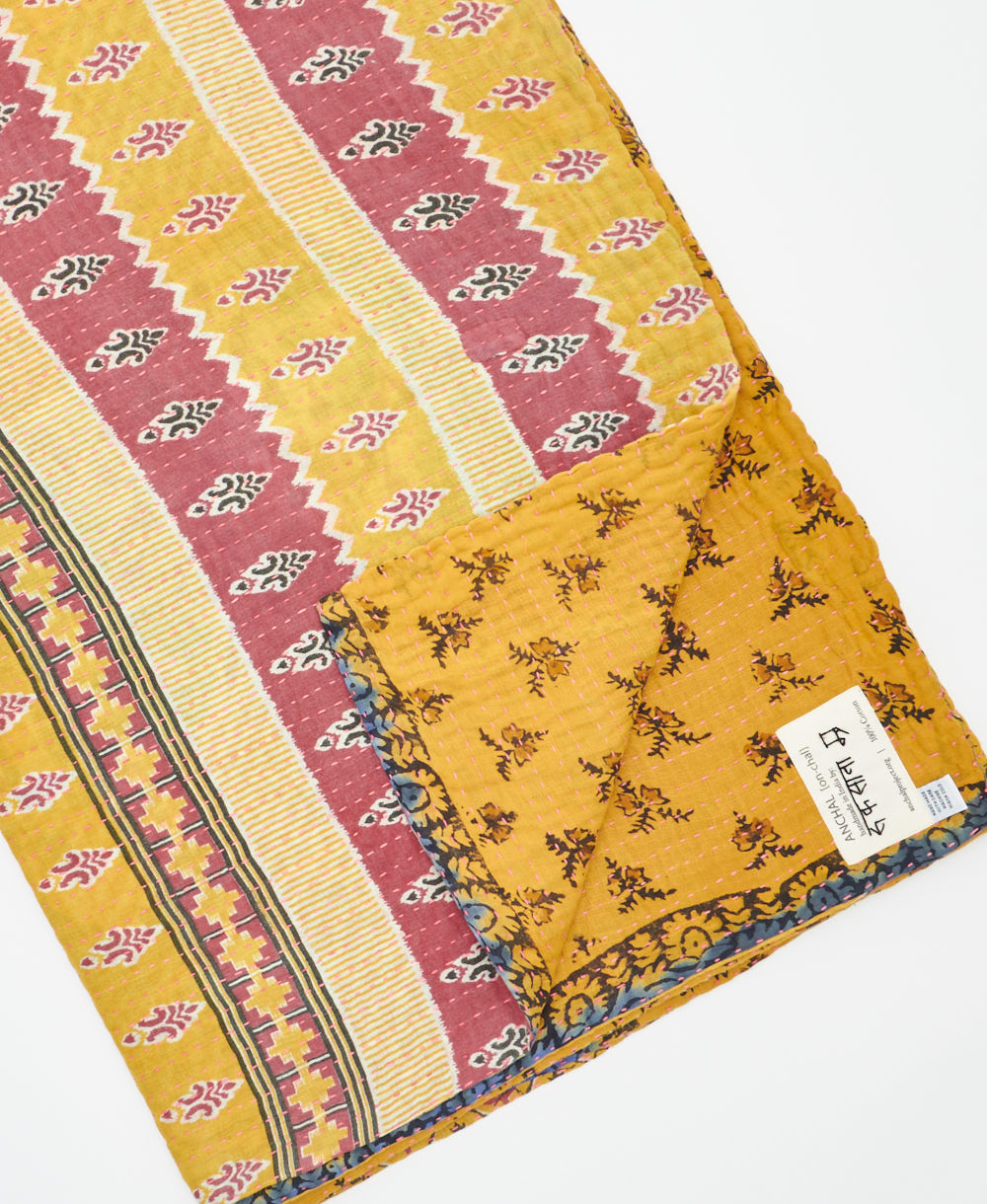 Kantha quilt throw featuring traditional kantha hand stitching