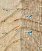 kantha quilt throw with a tag featuring the hand-stitched signature of the maker
