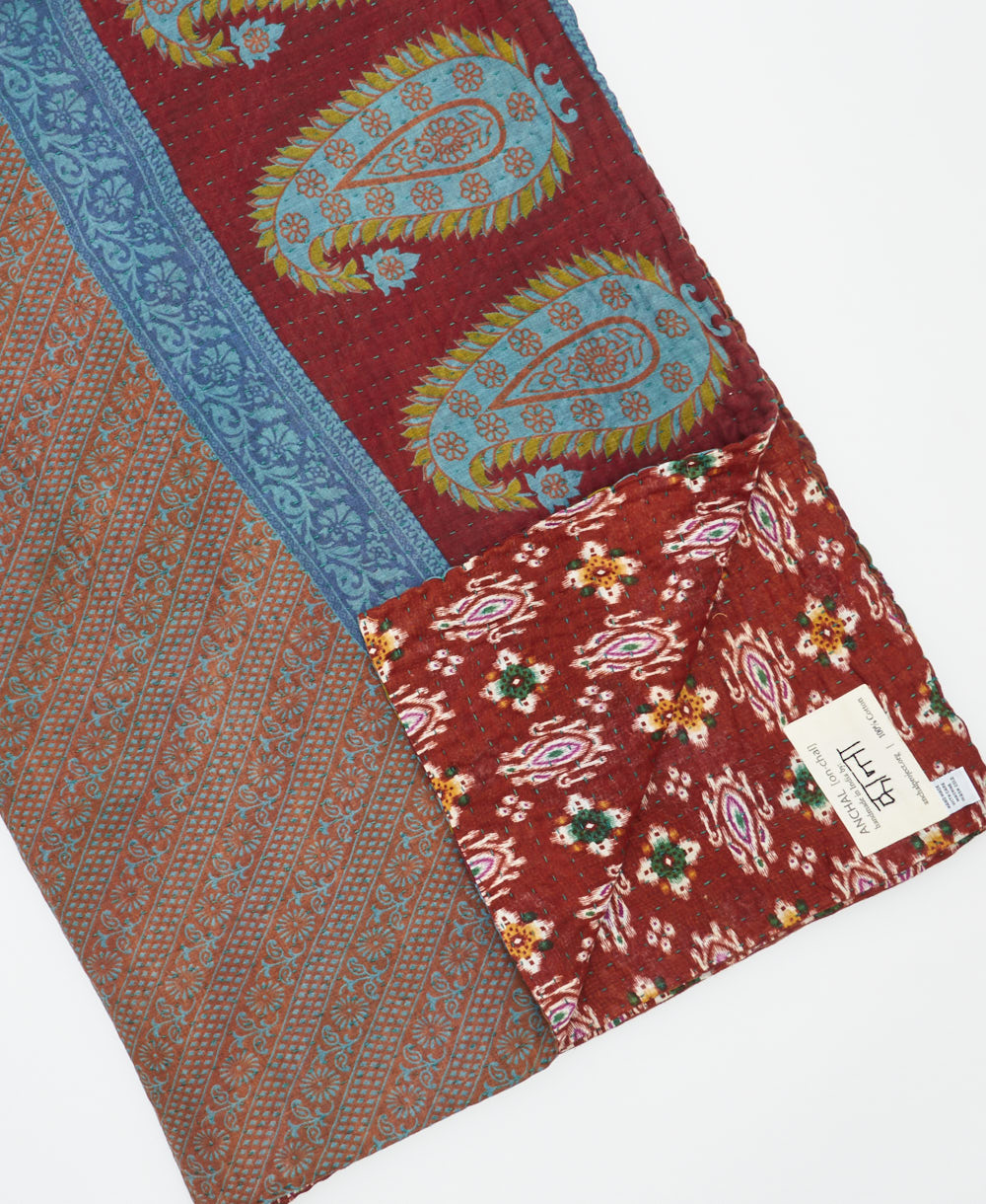 Kantha quilt throw featuring traditional kantha hand stitching