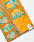 Kantha quilt throw featuring traditional kantha hand stitching