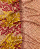 kantha quilt throw with a tag featuring the hand-stitched signature of the maker