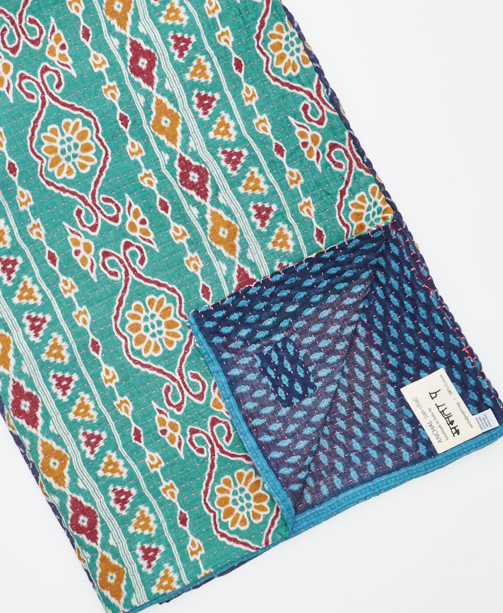 Kantha quilt throw featuring traditional kantha hand stitching