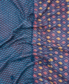 kantha quilt throw with a tag featuring the hand-stitched signature of the maker