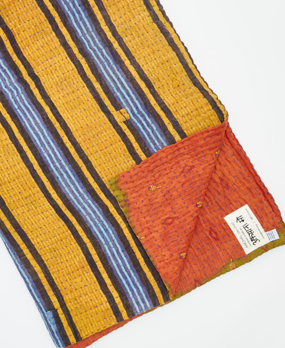 Kantha quilt throw featuring traditional kantha hand stitching