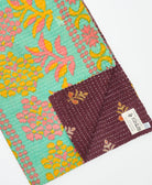 Kantha quilt throw featuring traditional kantha hand stitching