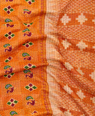 kantha quilt throw with a tag featuring the hand-stitched signature of the maker