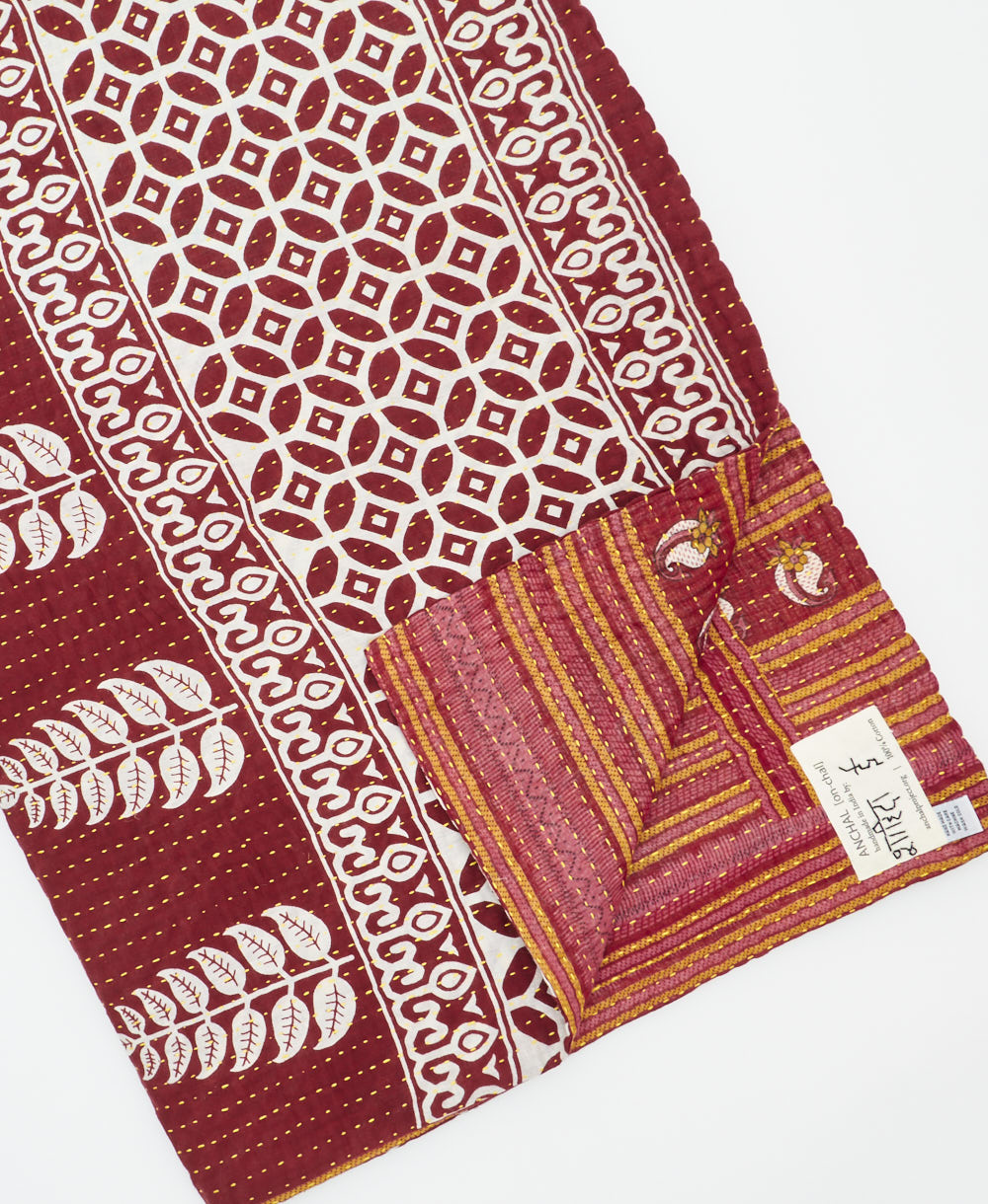 Kantha quilt throw featuring traditional kantha hand stitching