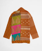 handmade open front cocoon quilted jacket in burnt orange featuring a colorful leaf print