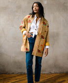 ethically made one-of-a-kind yellow quilted jacket with open front closure and rolled up sleeves