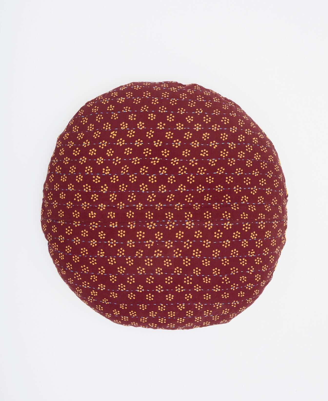 maroon round throw pillow with delicate tan dotted print made with one-of-a-kind fabrics