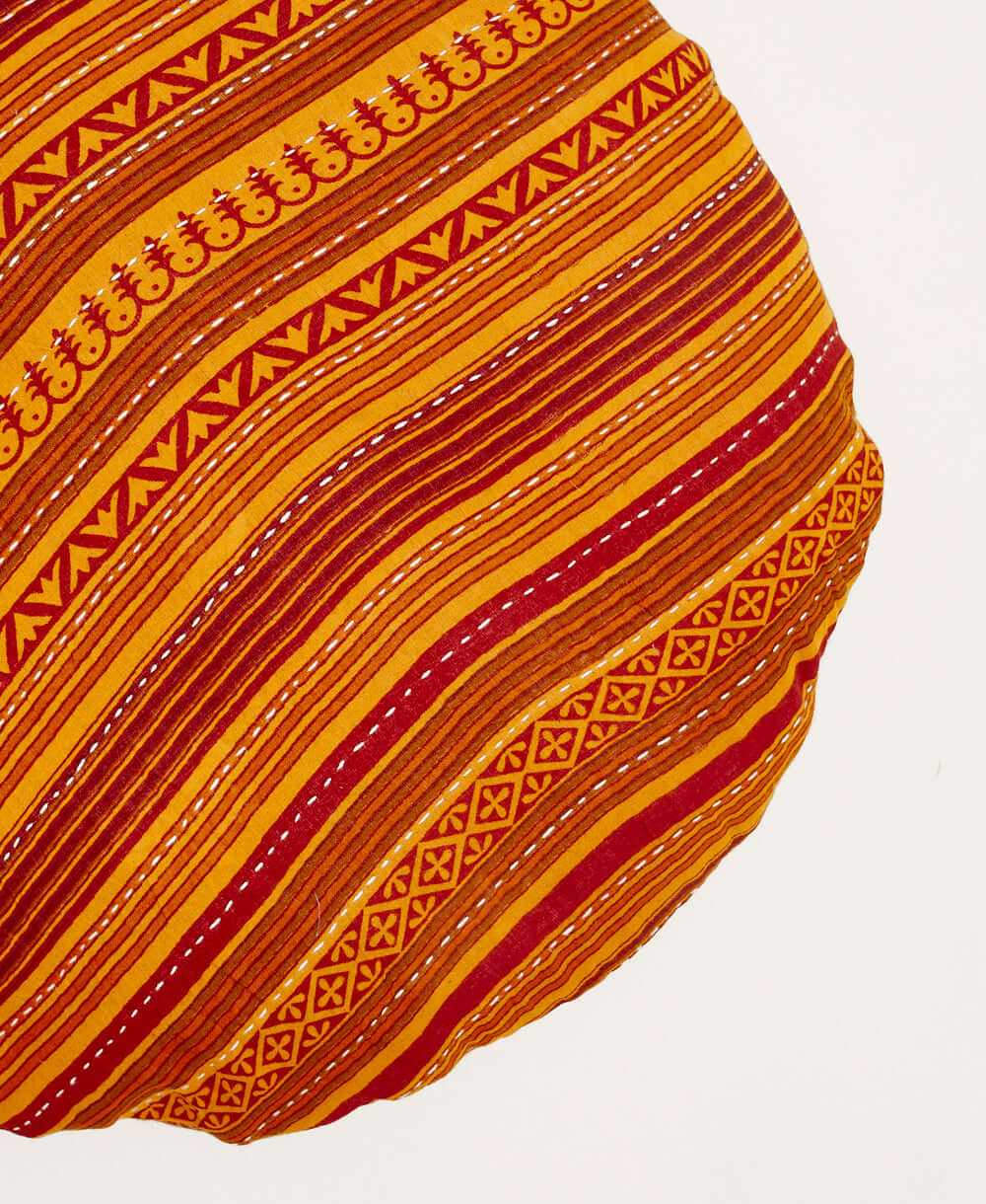 circle pillow with orange and red horizontal stripes handmade from vintage fabrics