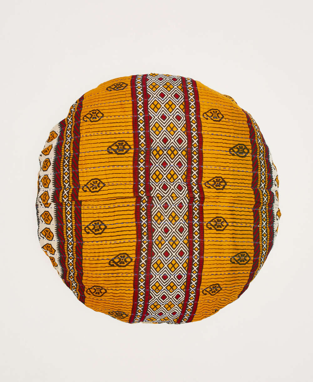 orange round throw pillow with yellow and red stripes by Anchal