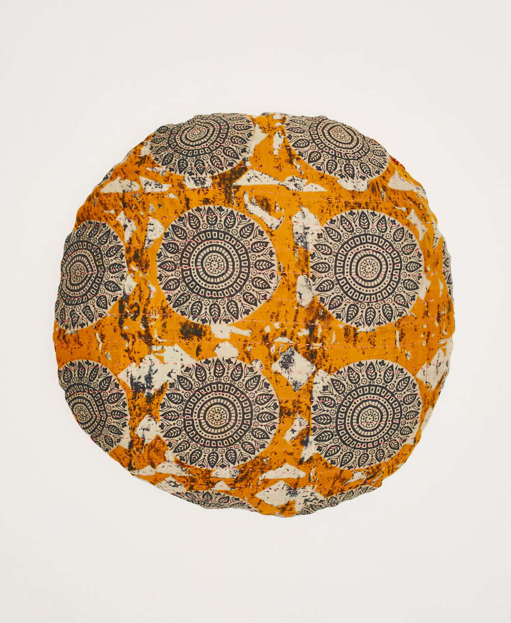 tangerine orange round pillow with black and white medallion print made from upcycled vintage cotton