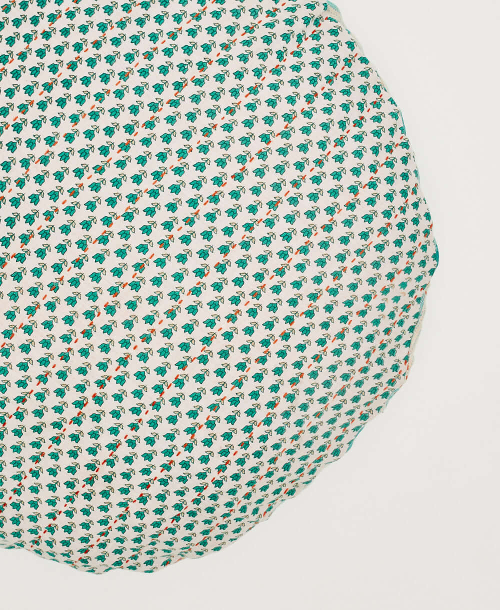 teal subtle tulip printed circle pillow with red kantha stitching handmade in India