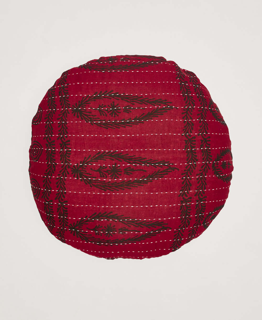 dark red round pillow with white kantha embroidered stitching made in India by women artisans